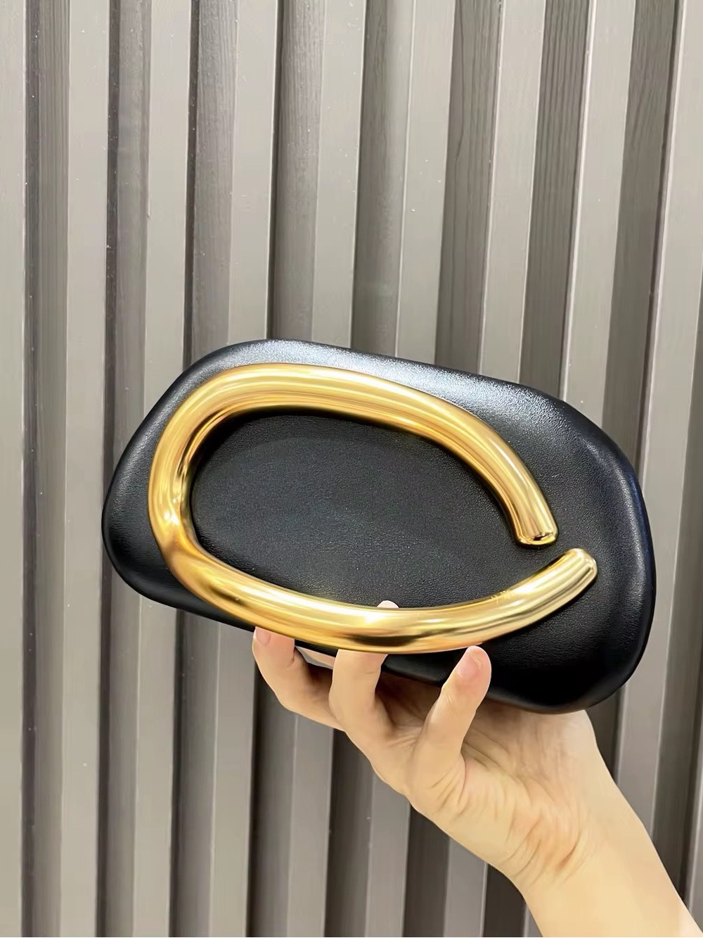 Elegant Black Clutch with Gold Accent Handle